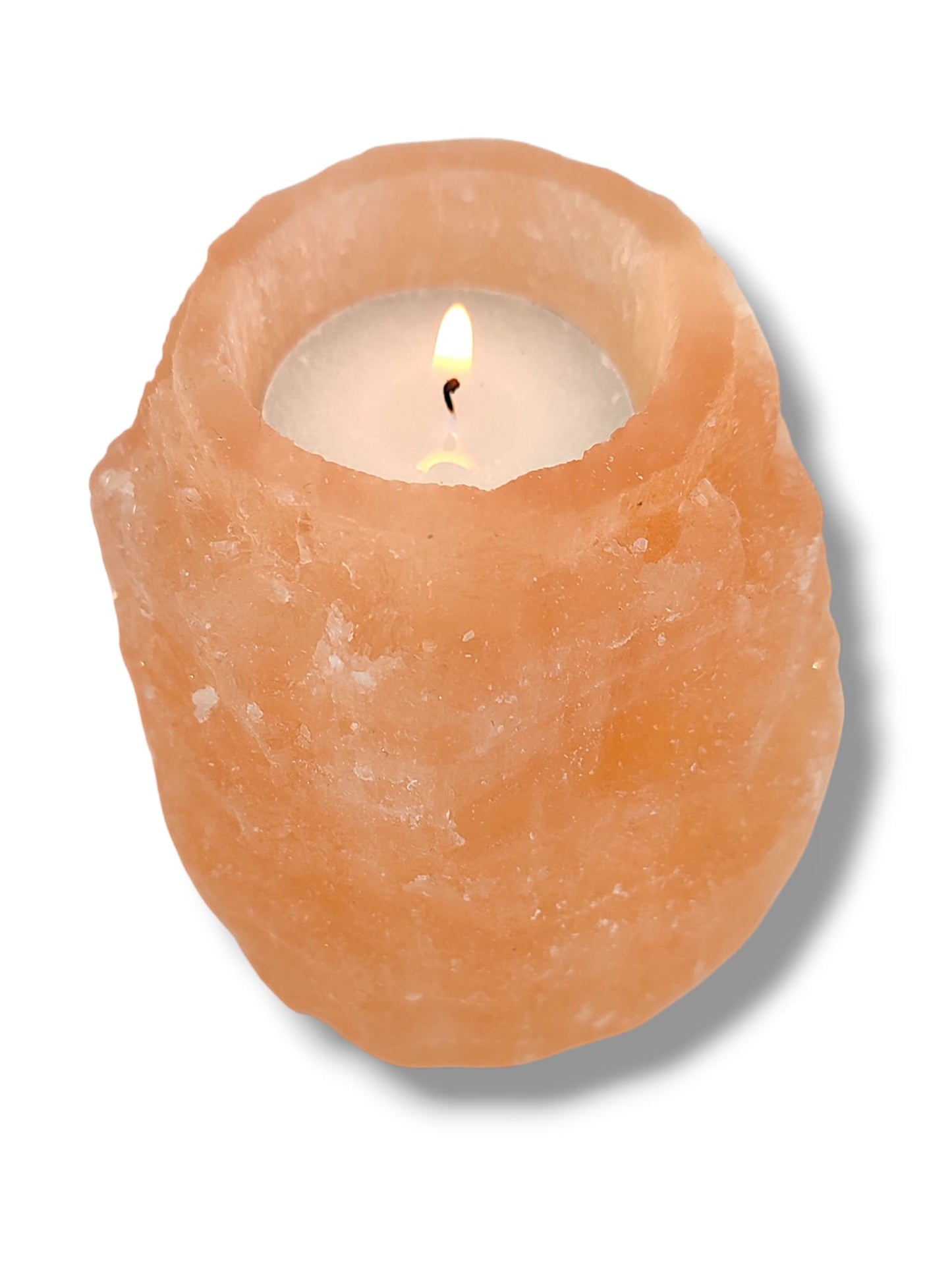 Portavelas de selenita naranja natural encendido luz cálida decoración energética